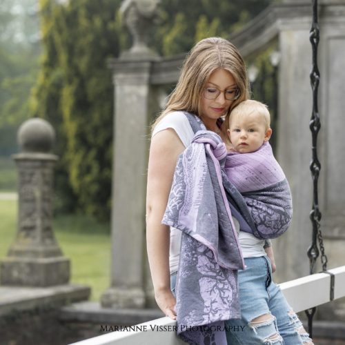 baby in pink lilac grey woven wrap sling