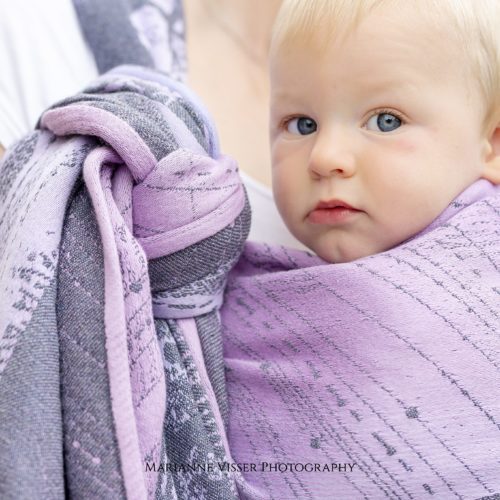 baby in pink lilac grey woven wrap sling