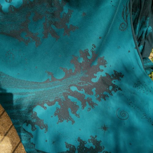 navy blue and teal jacquard woven fabric featuring crashing waves