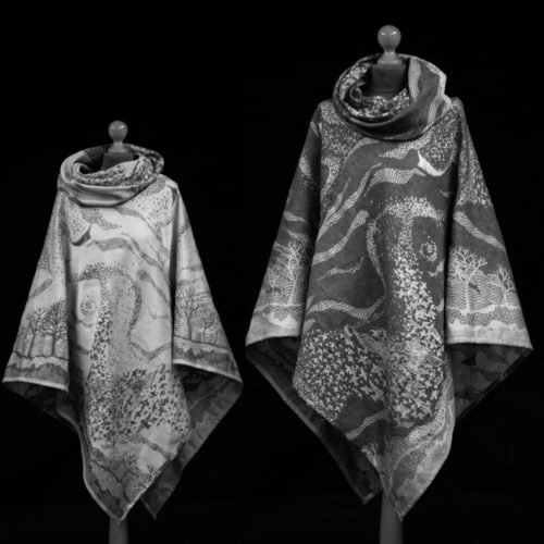 2 faces of a black and white wrap cloth poncho with a murmuration design of a flock of starlings
