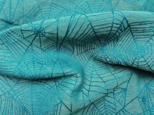 shimmery teal and turquoise cobwebs jacquard woven fabric