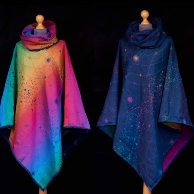 Navy and rainbow poncho made from organic combed cotton with a starmap design