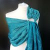 turquoise and teal ring sling with cobweb design