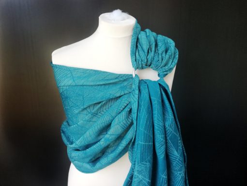 turquoise and teal ring sling with cobweb design