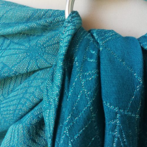 turquoise and teal ring sling with cobweb design