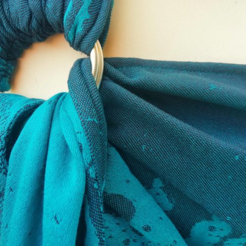 teal and navy ring sling with crashing waves design