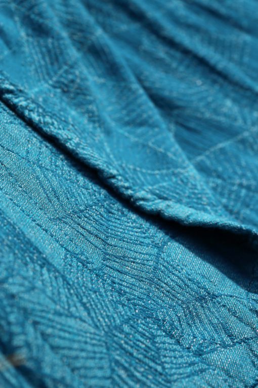 teal and turquoise woven warp with a cobweb design