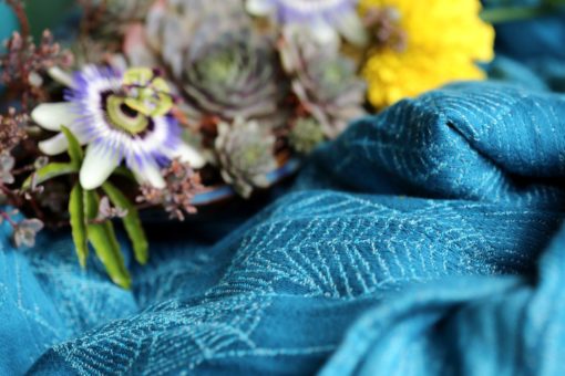teal and turquoise woven warp with a cobweb design