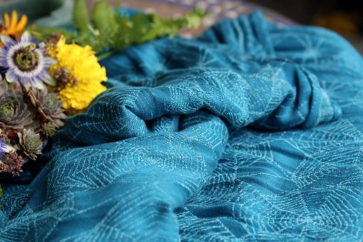 teal and turquoise woven warp with a cobweb design