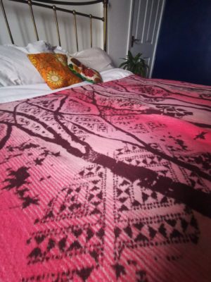 pink and burgundy birch forest patterned blanket