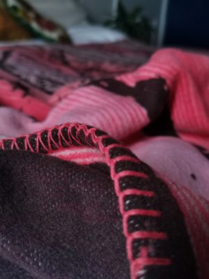 pink and burgundy birch forest patterned blanket
