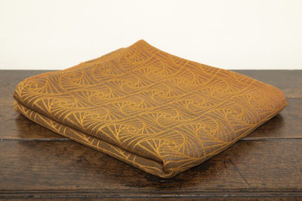 woven wraps feature a geometric design in a shimmery gradient of russet and brown supersoft linens against warm mustard-gold cotton for understated elegance