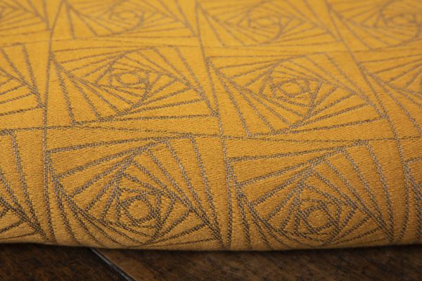 woven wraps feature a geometric design in a shimmery gradient of russet and brown supersoft linens against warm mustard-gold cotton for understated elegance