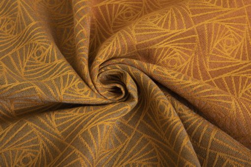 woven wraps feature a geometric design in a shimmery gradient of russet and brown supersoft linens against warm mustard-gold cotton for understated elegance