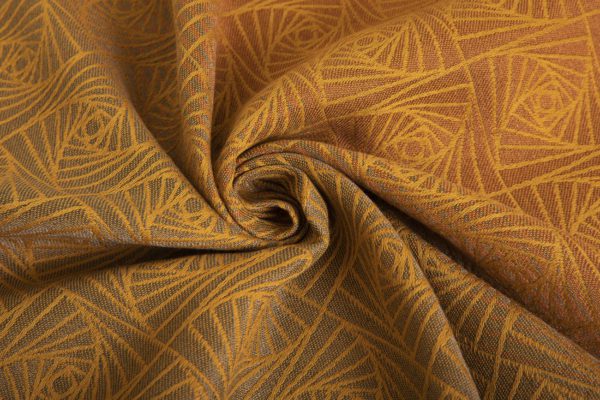 woven wraps feature a geometric design in a shimmery gradient of russet and brown supersoft linens against warm mustard-gold cotton for understated elegance