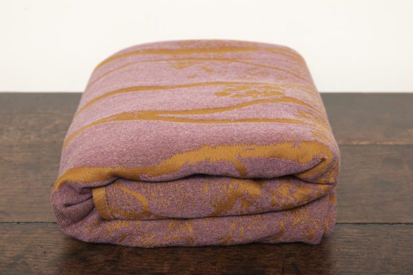 A woven wrap made from fluffy pink -grey merino wool and golden mustard cotton in a birch trees design